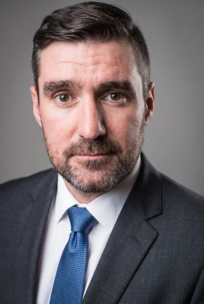 AI-generated portrait of Andrew Barnett, keynote speaker
