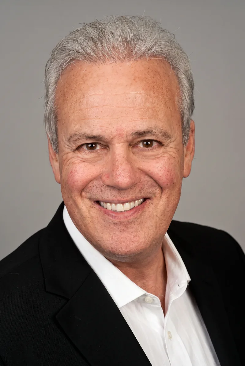 AI-generated portrait of John Deeks, keynote speaker