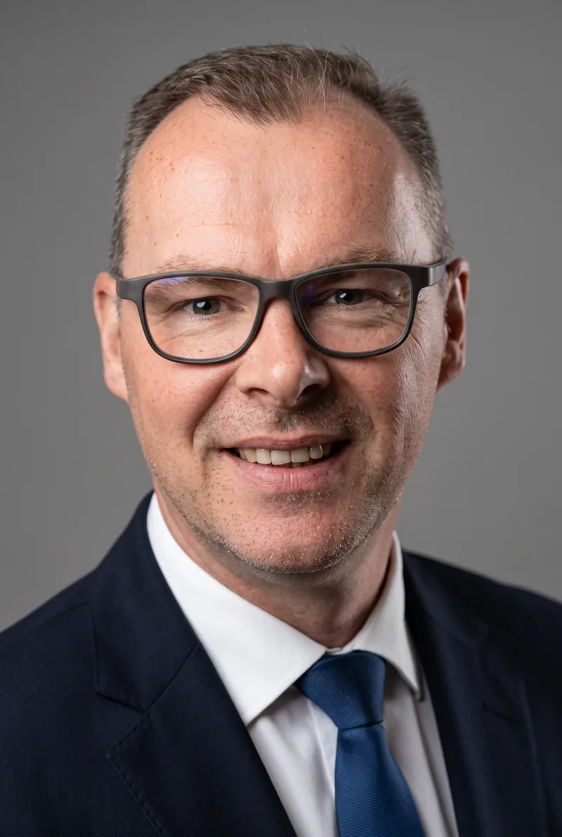 AI-generated portrait of Julian Moore, keynote speaker