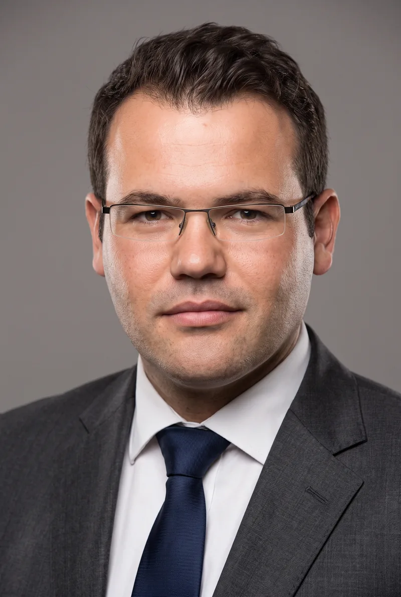 AI-generated portrait of Ruslan Kogan, keynote speaker