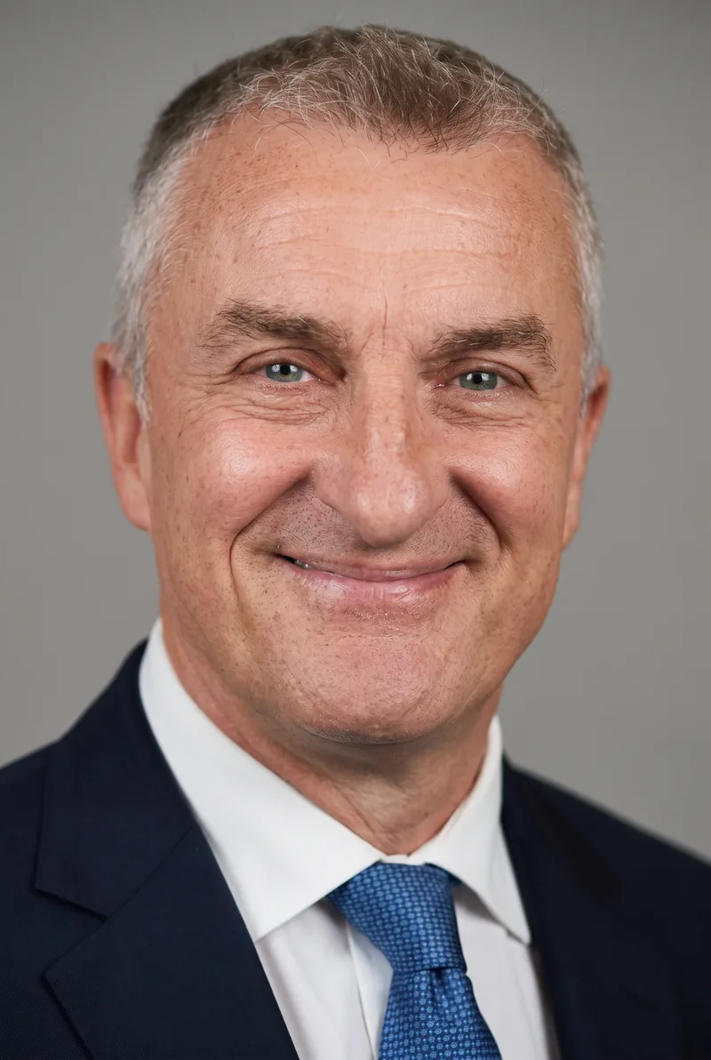 AI-generated portrait of Tom Elliott, keynote speaker